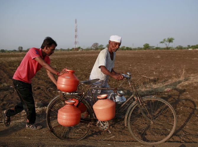 A duo carries water in drought-hit Latur