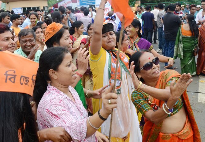 BJP supporters in Guwahati celebrate the party's victory in Assam