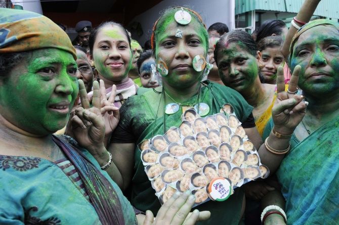 Trinamool Congress workers celebrate their party's victory in the assembly elections.