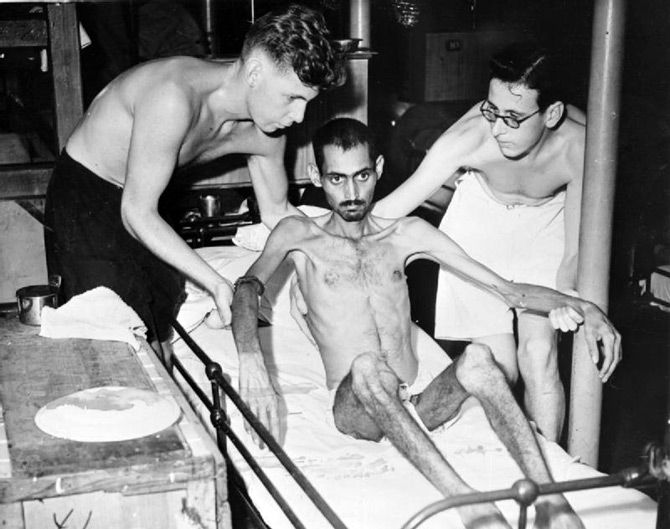 An Indian soldier held prisoner of war by the Japanese is attended to by nursing staff on board the hospital ship Oxfordshire. Photograph: Kind courtesy Imperial War Museum/Wikipedia.org