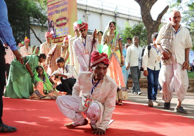 A differently abled couple arrives at the venue with their guests.