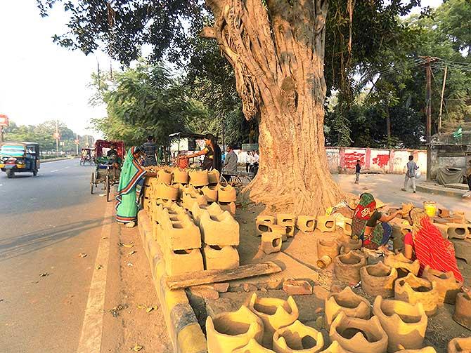 Muslim women making handmade earthen stoves for Chhath