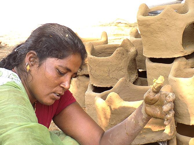 Muslim women making handmade earthen stoves for Chhath