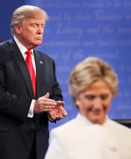 Democratic presidential nominee Hillary Clinton walks off stage as Republican Donald Trump looks on during the third US presidential debate in Las Vegas. Photograph: Drew Angerer/Getty Images
