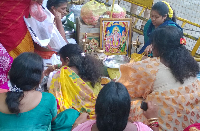 Seated on the pavement outside Apollo Hospitals, AIADMK women workers pray for Jayalalithaa's swift recovery