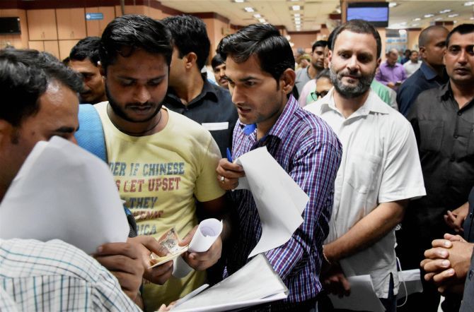 Congress MP Rahul Gandshi in queue at a Delhi bank. Photograph: Vijay Verma/PTI Photo