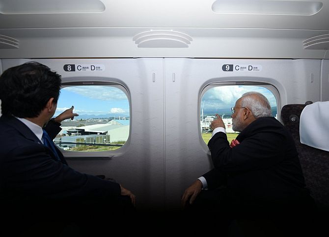 Prime Ministers Narendra Modi and Shinzo Abe on the bullet train