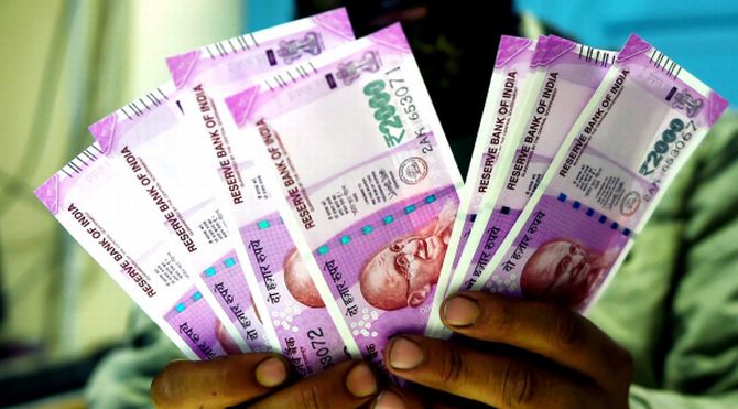 670px x 371px - LIVE! School kids photocopy Rs 2,000 note, buy confectioneries - Rediff.com  news