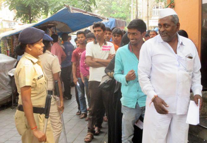 MUMBAI: Security forces were deployed to manage anxious crowds outside banks and ATMs. Photograph: Sahil Salvi