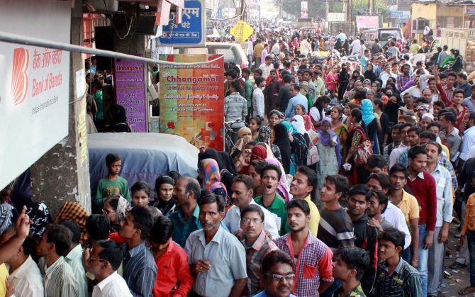 LUCKNOW: People queue up outside a bank. Photograph: Nand Kumar/PTI Photo