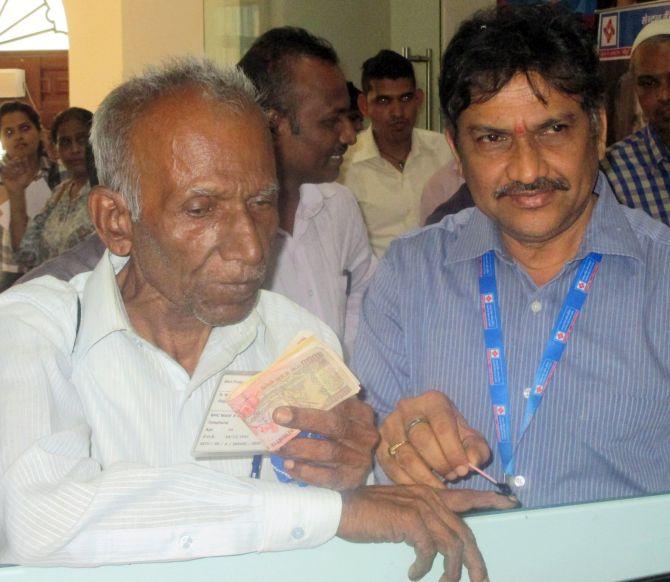 A man gets his finger inked as he exchanges his old notes in Mumbai. Photograph: Sahil Salvi