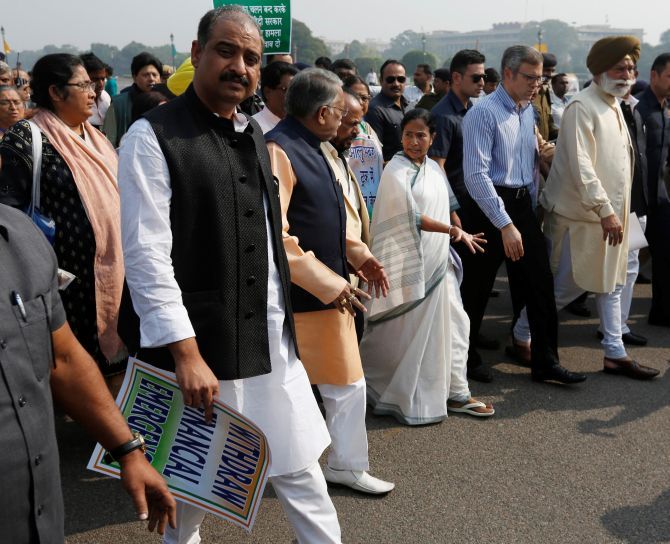 IMAGE: West Bengal Chief Minister Mamata Banerjee leads a march to Rashtrapati Bhavan to protest against demonestisation. Photograph: PTI Photo