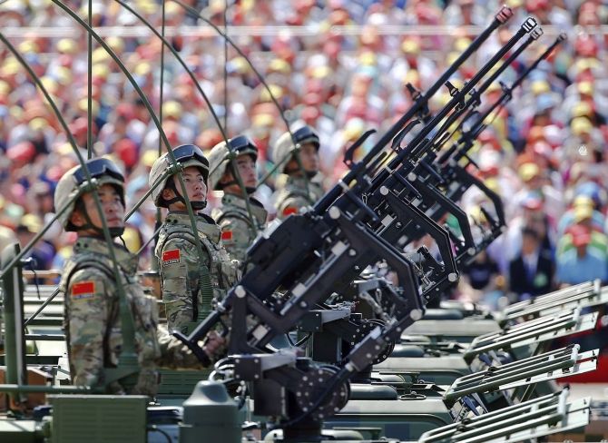 Soldiers of China's People's Liberation Army during a military parade in Tiananmen Square. Photograph: Reuters