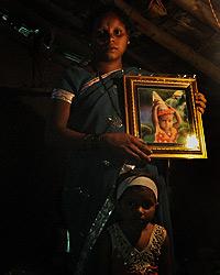 Mamta Gurunath Savar with her daughter Shalini inside their house in village Petranjani of Mokhada taluka in Palghar district of Maharashtra