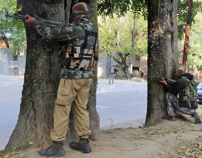 Troops take positions to neutralise terrorists at Langate, Kashmir, last October. Photograph: Umar Ganie