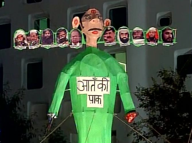 Ravan's effigy at the IP Extension in New Delhi with photographs of Pakistan PM Nawaz Sharif, army chief General Raheel Sharif, Lashkar-e-Tayiba terrorist Muhammed Saeed and other terrorists. The text reads, 'Aatanki Pak (terrorist Pakistan).'  Photograph: ANI