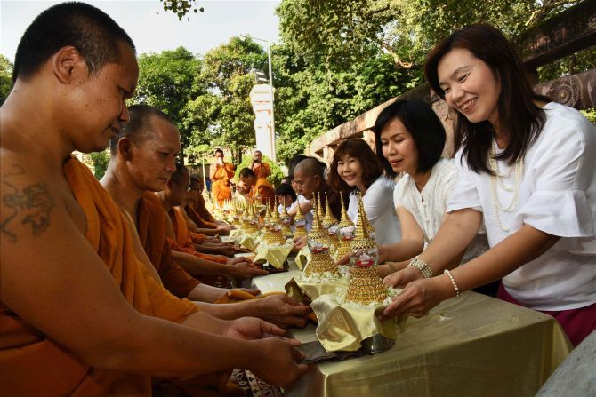 Thai devotees offer prayers with relics of Lord Buddha at Mahabodhi Temple in Bodh Gaya