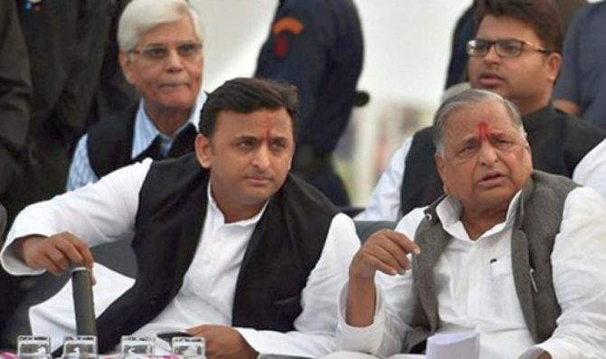 Uttar Pradesh Chief Minister Akhilesh Yadav, left, with his father, Samajwadi Party founder Mulayam Singh Yadav