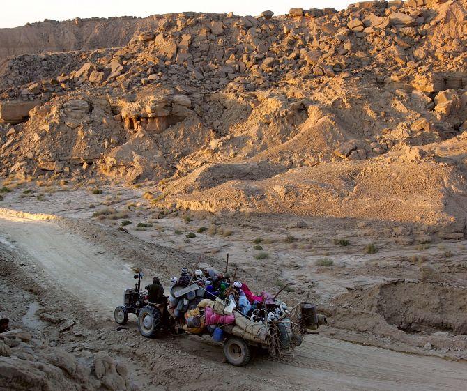 A family from the Bugti tribe evacuates the city of Dera Bugti in the Balochistan province. Photograph: John Moore/Getty Images.