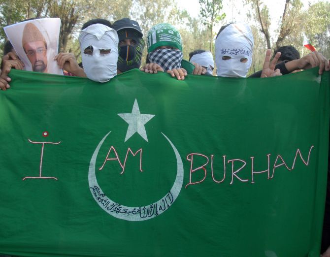 Protesters carry a banner reading 'I am Burhan'. Photograph: Umar Ganie/Rediff.com
