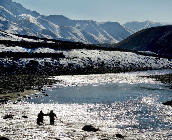 The Panjshir river with the Hindu Kush mountains in the background. 