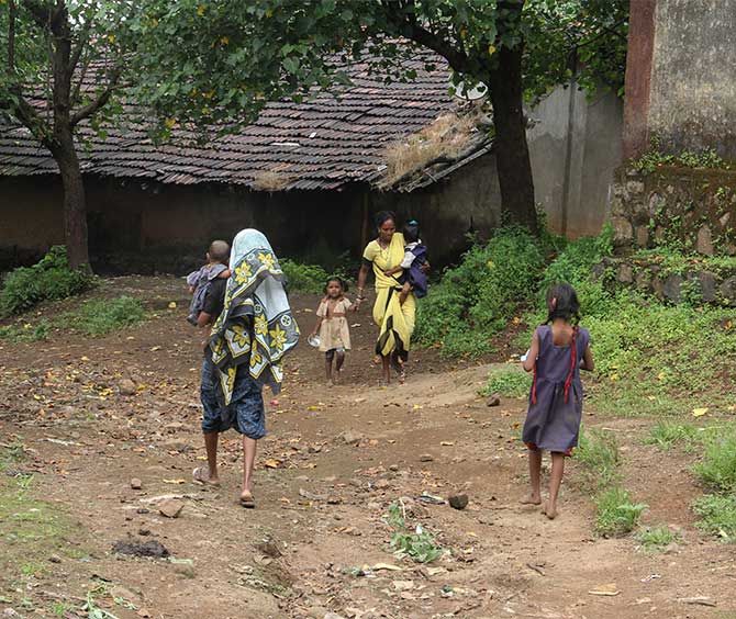 Not all children come regularly to the Pimpalwadi anganwadi. Smita Wagh, in yellow, an assistant to Lahubhuge, then goes home hopping and brings these children in her tow to the anganwadi.