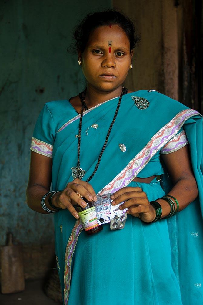 Mamta, who is eight-month pregnant, shows the iron and zinc supplements that she gets regularly from a local hospital as part of a health scheme run by the Maharashtra government for pregnant women. Ironically, these medicines are administered to pregnant mothers for better nourishment of the child in the mother's womb.