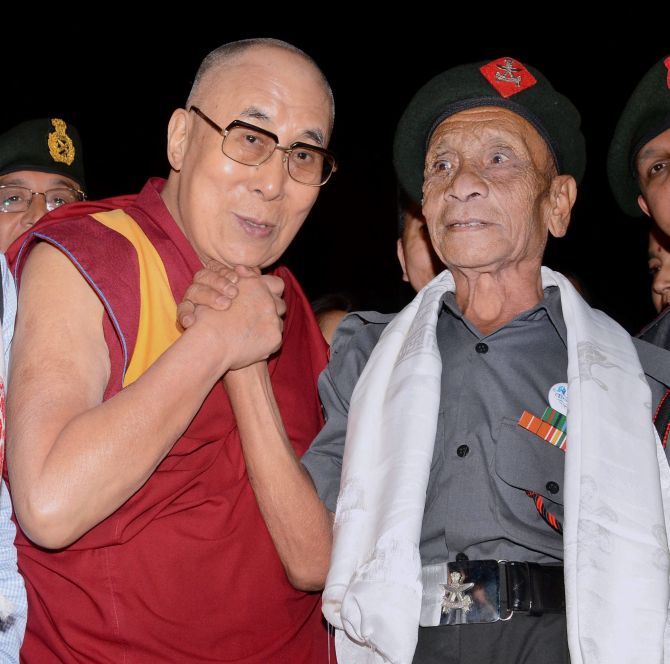 His Holiness The Dalai Lama with retired Havaldar Naren Chandra Das, one of the five Assam Rifles soldiers who escorted him to India during his escape from Tibet in March 1959. Photographs: PTI Photo