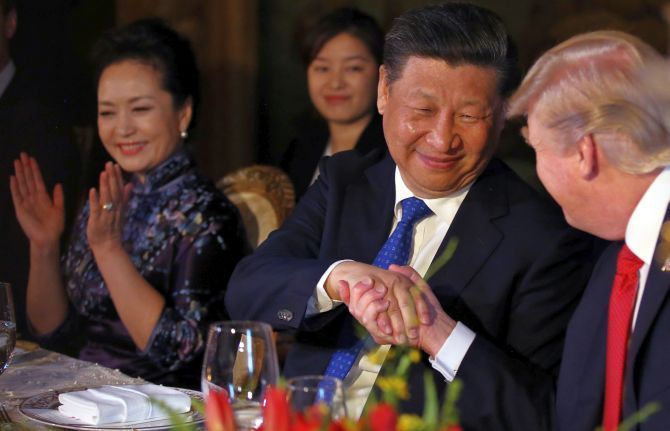 Chinese President Xi Jinping, his wife Peng Liyuan with US President Donald Trump at the dinner during their summit at Trump’s Mar-a-Lago estate in West Palm Beach, Florida. Photograph: Carlos Barria/Reuters