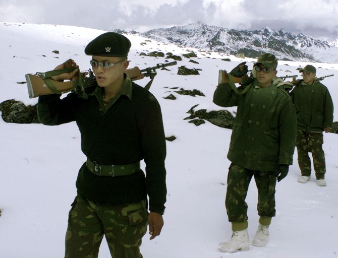 Indian soldiers patrol the border with China at high altitudes. Photograph: Utpal Baruah/Reuters