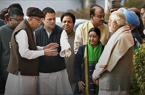 Rahul Gandhi escorts former deputy prime minister Lal Kishenchand Advani as Prime Minister Narendra Damodardas Modi looks on, Parliament House, December 13, 2017.