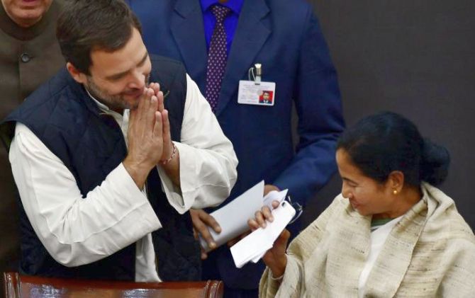 Rahul Gandhi greets Mamata Banerjee. Photograph: PTI Photo