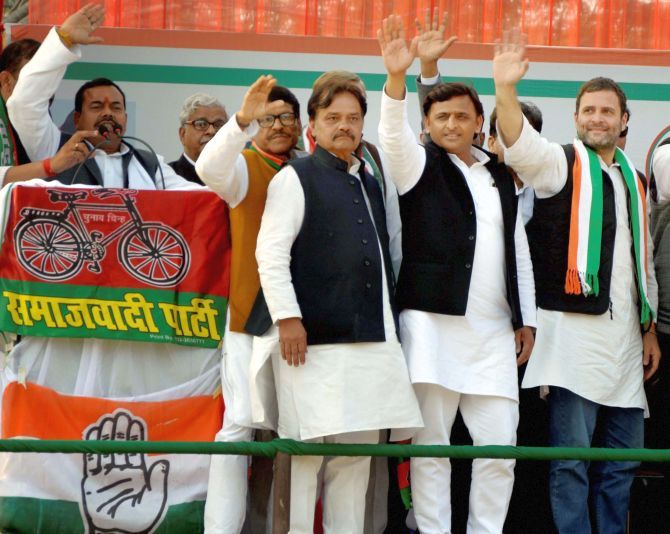 Samajwadi Party leader Akhilesh Yadav and Congress Vice-President Rahul Gandhi, second from right and right respectively, at a political rally