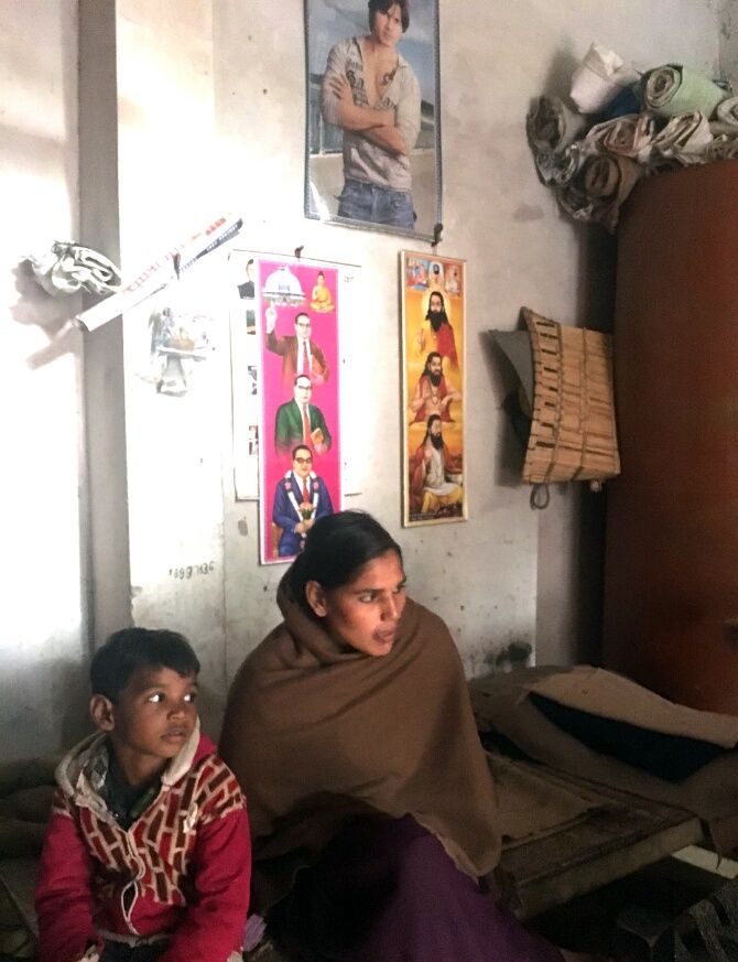 Usha Rani in her home with posters of Shahid Kapur, Ambedkar and ant Ravi Das