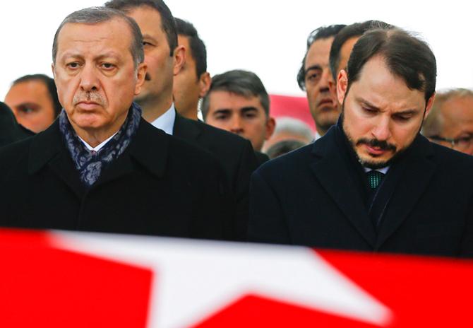 Turkish President Tayyip Erdogan, left, accompanied by Energy Minister Berat Albayrak, at the funeral of police officer Hasim Usta who was killed in an Istanbul terror attack, December 12, 2016. Photograph: Osman Orsal/Reuters