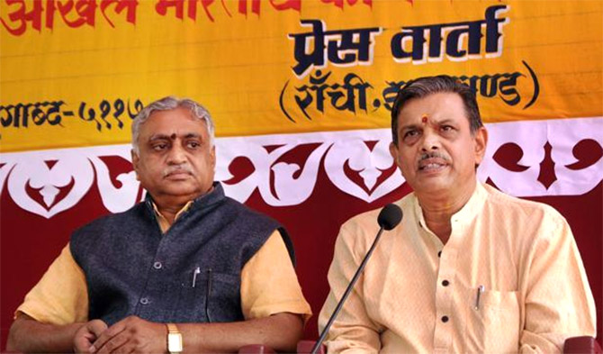RSS thinkers Manmohan Vaidya and Dattatreya Hosabale at a press conference.