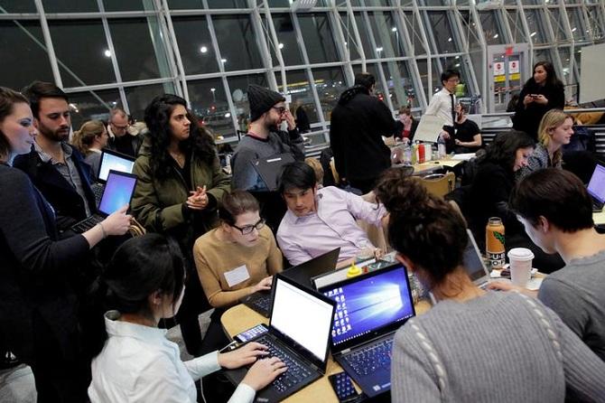 Volunteer lawyers work in a dining area of Terminal 4 at JFK International Airport in New York, January 29, to assist travelers detained as part of Donald Trump's travel ban. Photograph: Andrew Kelly/Reuters