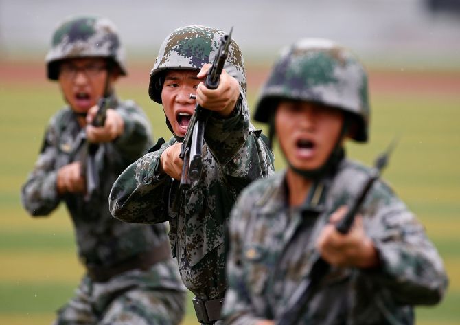 People's Liberation Army soldiers at a drill in Beijing. Photograph: Peter Kujundzic/Reuters
