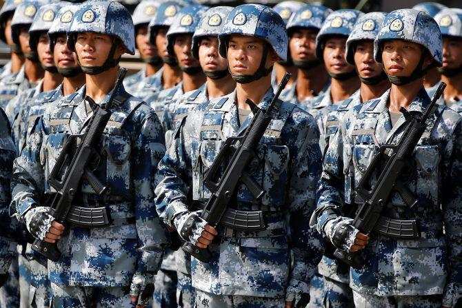 People's Liberation Army soldiers march in Beijing. Photograph: Damir Sagolj/Reuters