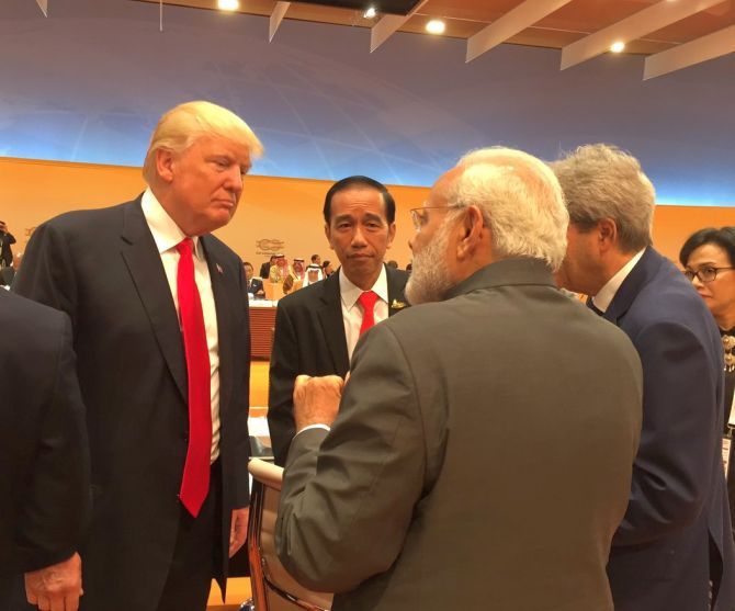 Prime Minister Narendra D Modi chats with US President Donald J Trump at the G-20 summit in Hamburg, July 8, 2017. Photograph: Kind courtesy Arvind Panagariya