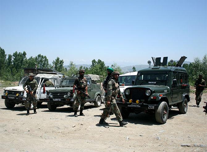 Soldiers cordon off the area where terrorists attacked an army convoy at Qazigund, south Kashmir, June 3. Photograph: Umar Ganie for Rediff.com