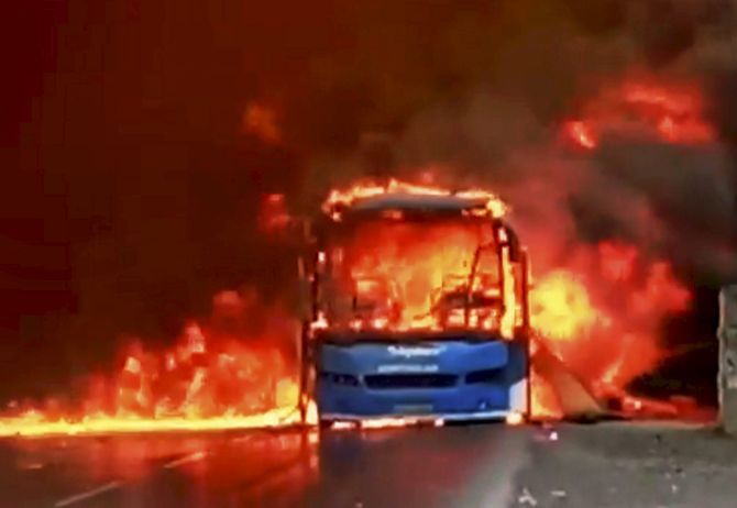 A bus in flames after it was torched by farmers on the Bhopal-Indore highway in Dewas, Madhya Pradesh, during the farmers agitation in MP in June 2017. Photograph: PTI Photo