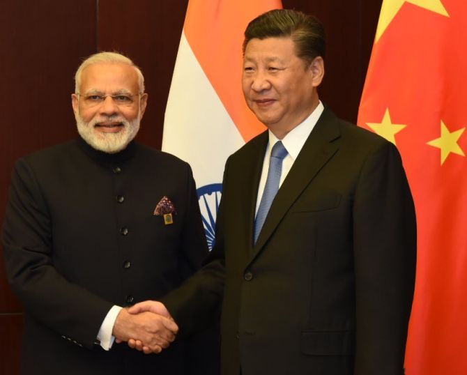 Prime Minister Narendra Modi with Chinese President Xi Jinping on the sidelines of the Shanghai Cooperation Organisation summit in Astana, June 9, 2017. Photograph: MEAIndia/Twitter