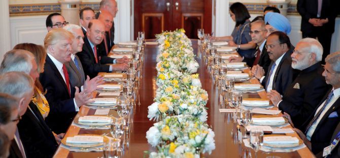 US President Donald J Trump, Prime Minister Narendra Modi with their respective delegations at the White House dinner. US Vice-President Mike Pence can be seen seated to Trump's left. Photograph