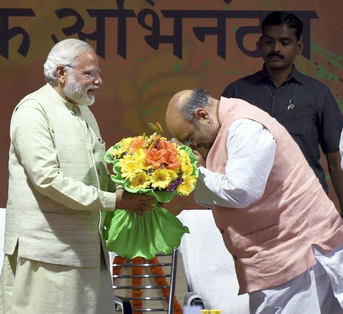 Bharatiya Janata Party President Amit Shah greets Prime Minister Narendra Modi. Photograph: Kamal Singh/PTI Photo