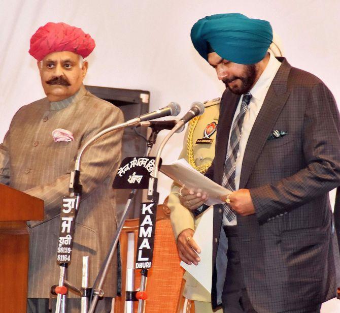 Navjot Singh Sidhu takes the oath as a minister in the Amarinder Singh government, March 16, 2017. Photograph: PTI Photo