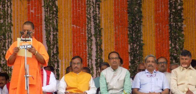 Yogi Adityanath takes the oath of office watched by Uttar Pradesh Deputy Chief Minister Dr Dinesh Sharma, the chief ministers of Madhya Pradesh (Shivraj Singh Chouhan), Goa (Manohar Parrikar) and Andhra Pradesh (Nara Chandrababu Naidu). Photograph: Sandeep Pal