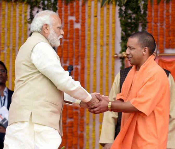 Prime Minister Narendra Modi congratulates Uttar Pradesh Chief Minister Yogi Adityanath after he was sworn in, March 19, 2017. Photograph: PTI Photo