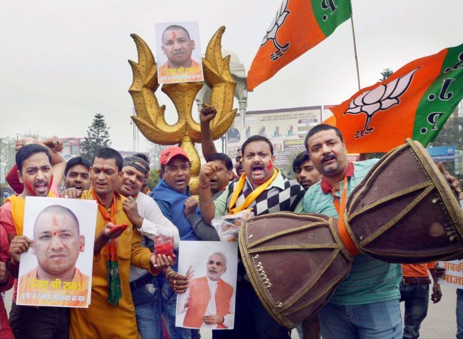 Yogi Adityanath's supporters celebrate his elevation to the post of UP CM. 