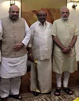 Vellapally Natesan flanked by Amit Shah, left, and Narendra Modi.